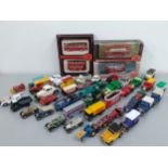 A quantity of diecast models of buses, vintage, classic and racing cars to include Matchbox and