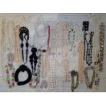 A quantity of vintage bead and faux pearl necklaces to include Aurora Borealis examples and faux