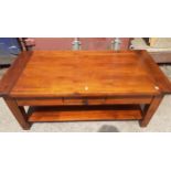 A mango wood coffee table having shelf below and drawer Location: