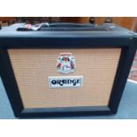 An Orange electric amplifier with integral Celestian G12 loudspeaker. Location:A2F