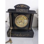 A Victorian black slate 8-day mantel clock Location: