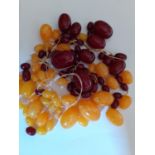 A quantity of vintage loose cherry amber and butterscotch amber beads. Location:Cab