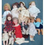 A quantity of collectors dolls to include a German 'G&S' bisque head doll, a black baby doll and mid