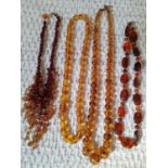 A string of vintage amber beads and 3 amber effect bead necklaces. Location:Cab