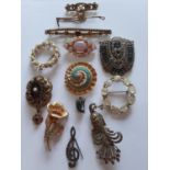 A small quantity of early to mid 20th Century brooches and a shoe clip to include a silver