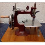 An Essex Miniature sewing machine with instruction manual and original hard case. Location:BWR