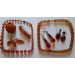 A quantity of vintage amber and amber coloured jewellery A/F to include 2 pairs of amber earrings.