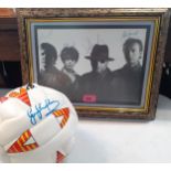 A signed and framed photograph of The Stranglers together with a signed Gary Linekar football (Mitre