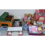 A mixed lot of toys to include dolls, Alice in Wonderland tea party game, and other items Location: