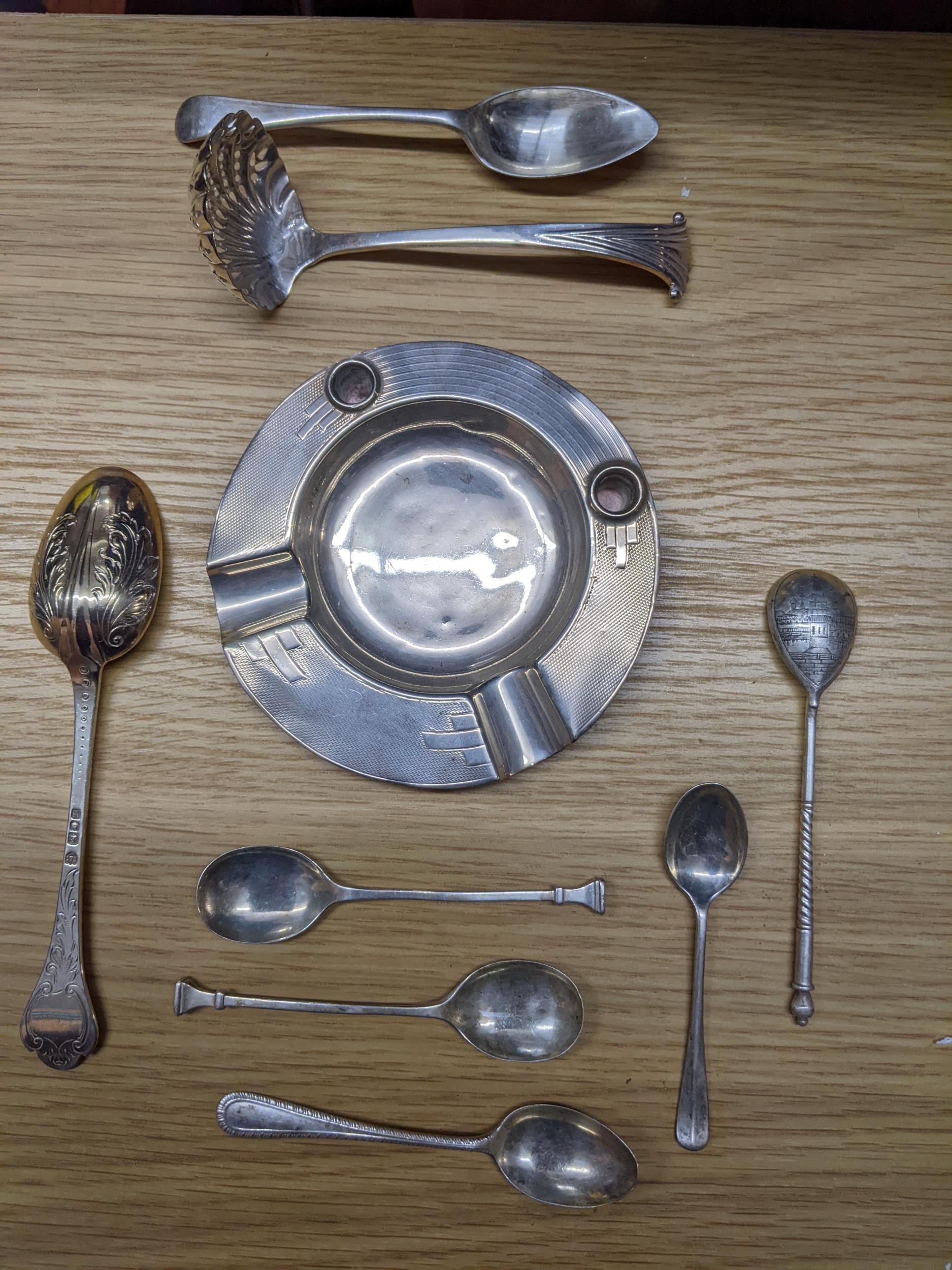 A selection of silver and silver plated items to include a Russian picture back spoon, Art Deco