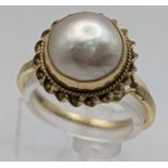 A 9ct gold Mabe pearl set ring 2.9g Location: