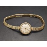 A 9ct gold ladies manual wind watch on a 9ct gold bracelet, 15.8g Location: