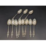 A set of eleven 800 silver teaspoons having initials and pierced handles, 80.3g