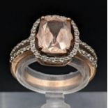 A 9ct gold Morganite and white sapphire ring 2.9g Location: