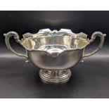 A silver twin handled bowl having scroll shaped handles, on a turned base, total weight 337.1g