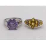 Two rings to include a 9ct gold yellow sapphire cluster ring 2.6g, and a rolled gold ring with a