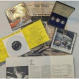 A cased set of three silver medals commemorating man's first landing on the moon, together with