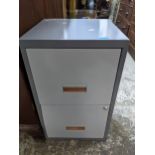 A grey finished metal two-drawer filing cabinet with light grey drawer fronts 66.5cm x 40cm x 40cm