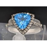 A 9ct white gold blue topaz and diamond ring, 2.8g Location: