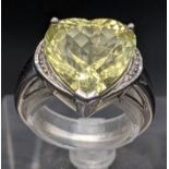 A 9ct white gold yellow topaz heart-shaped ring with two diamonds, 5g Location: