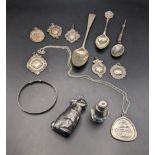A mixed lot of silver to include silver tea and coffee spoons, silver fob pendants and others, total