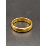A 22ct gold wedding band, total weight 5.6g Location: