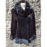A good quality Italian black mink jacket having a black bejewelled button to the shawl collar