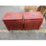 A pair of Chinese lacquered cabinets with removable lids and carved panelled fronts Location: