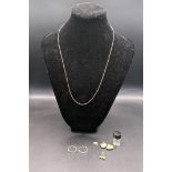 Various yellow metal items to include a pair of earrings, two heart shaped lockets, and others,