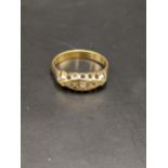 A 9ct gold ring set with diamonds, total weight 3.2g Location: