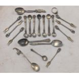 A collection of 925 and other silver spoons to include condiment spoons and pickle forks, along with