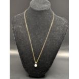 A 9ct gold necklace having a cultured pearl pendant, total weight 4.1g Location: