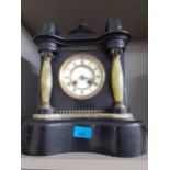 An early Victorian black slate, marble and green onyx mantel clock of architectural form with key