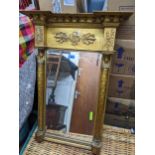 An early 20th century gilt framed pier mirror with Egyptian style decoration, bevelled plate,
