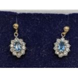 A pair of 9ct gold blue topaz and paste stones earrings Location: