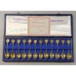 The twelve Roman spoons 22ct gold on sterling silver, together with a case and certificate of