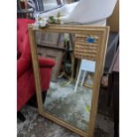 A contemporary pine framed wall mirror, 90cm x 60cm Location: