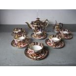 An Imari pattern part tea set to include Royal Crown Derby and Hammersley pieces and others,