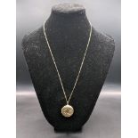 A yellow metal necklace tested as 9ct, together with a yellow metal locket pendant, tested as 9ct,