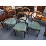 A set of four Victorian walnut balloon back dining chairs on front cabriole legs Location: