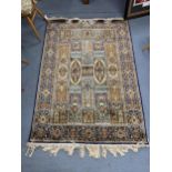 A Middle Eastern part silk rug with panels of flowers, 175cm x 126cm Location: