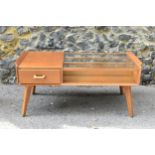 A mid century G-plan E. Gomme Brandon glass topped teak coffee table, with pull through drawer,