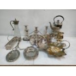 Silver plate to include a spirit kettle, a claret jug, a candelabra, dishes and other items