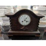 An early 20th century oak cased mantel clock, the white enamel Arabic dial marked with the Reading