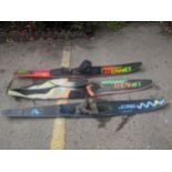 Two water ski mono boards, a Connelly signature series board with skip cover, and a Sobe