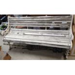 A Victorian Coalbrookdale style cast iron bench having a white painted scroll design frame