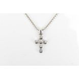 An 18ct white gold and diamond cross pendant, designed with six bezel set brilliant cut diamonds, on