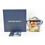 A Moorcroft pottery limited edition 'Tangerine Pansy' lidded pot, designed by Emma Bossons, 2011,