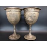 A pair of 1930's silver cups on knopped tapering stems, both with inscriptions, 163.4g Location: