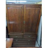 A Victorian mahogany linen press, twin panelled doors, with four interior sliding shelves, above a